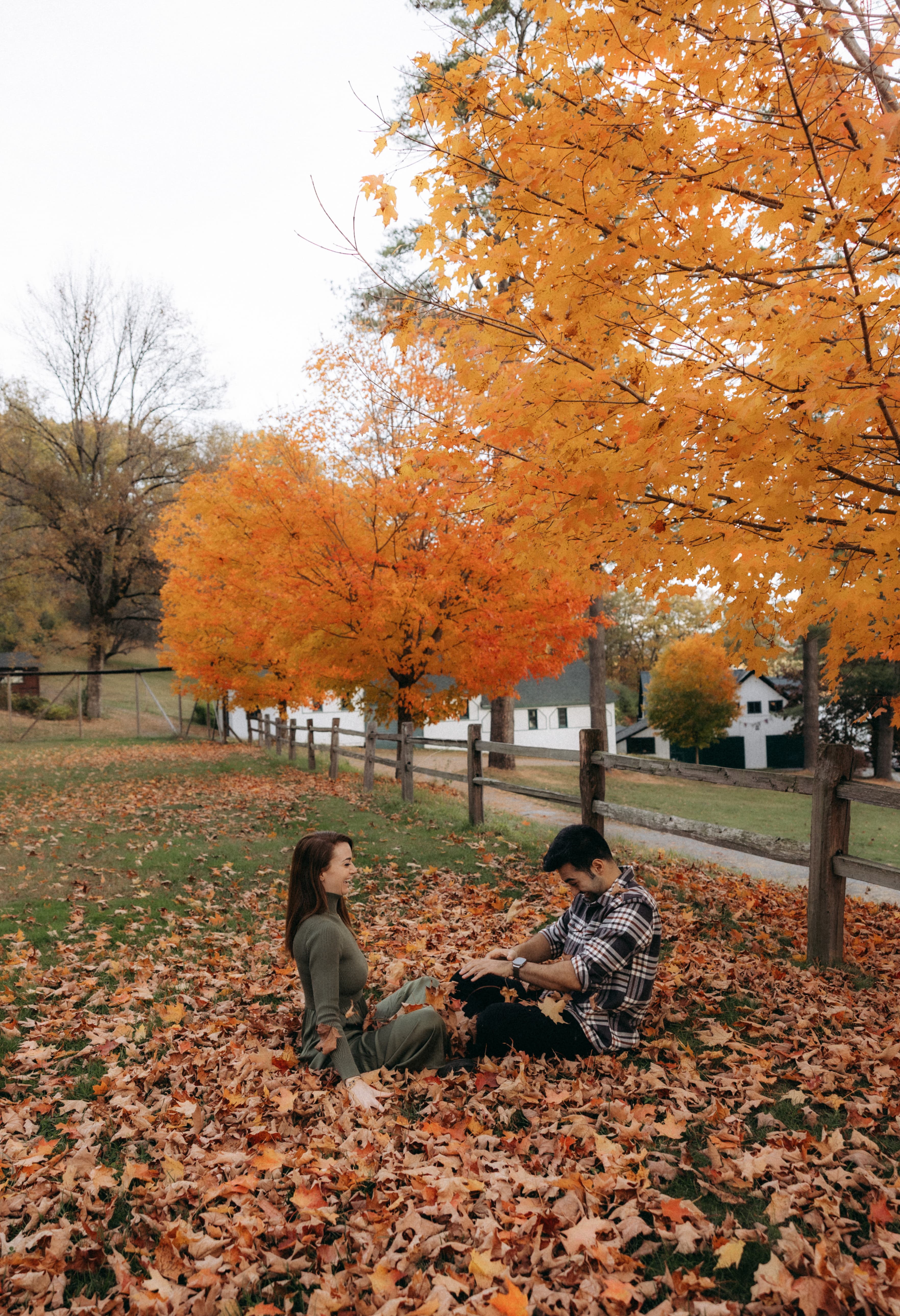 Alex and Caroline together under fall foliage